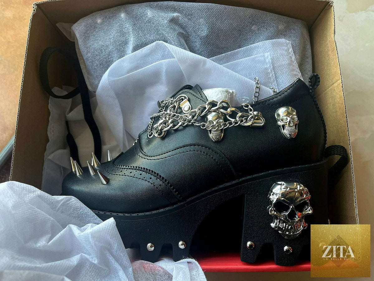 Women's skull shoes with spikes by donjohnbyvictoriacharles, featuring dark design and edgy style, shown on a white background.