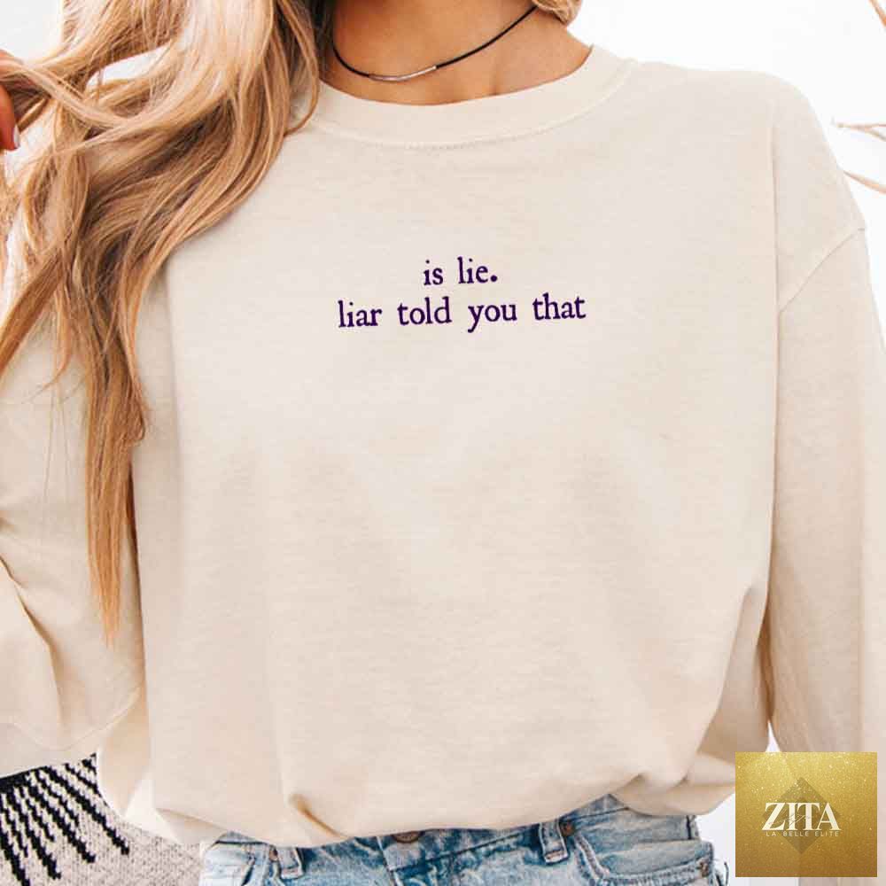 Comfort Colors long sleeve T-shirt featuring "Is Lie, Liar Told You That" text, from Adorb Custom Tees, in a close-up view.