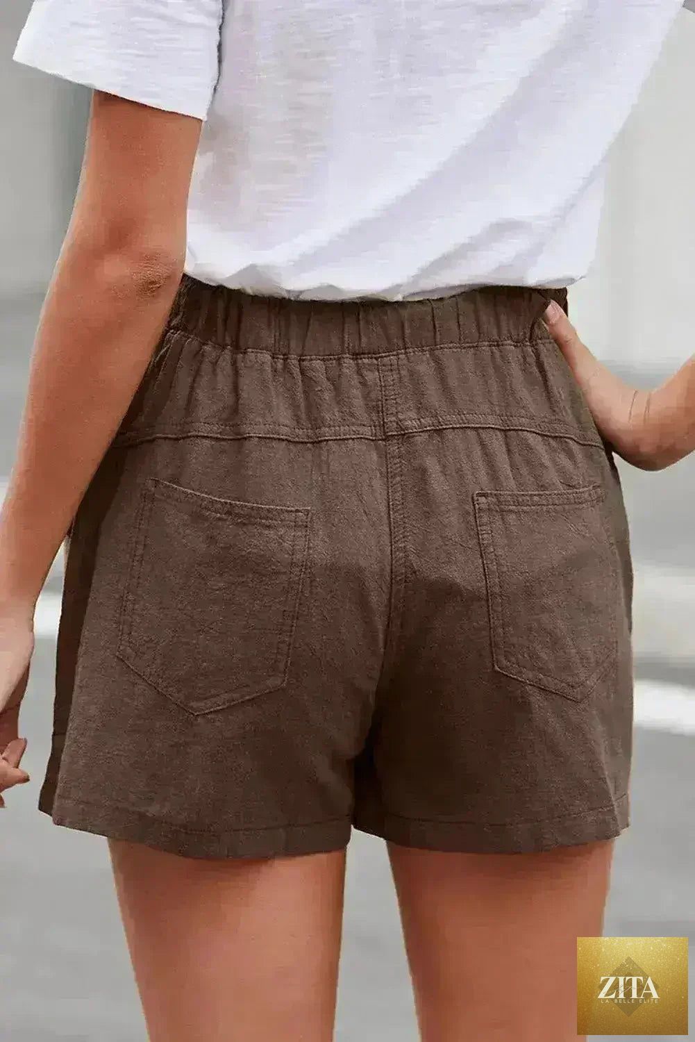 Women’s casual khaki Faylin linen shorts by Femstylo, featuring a relaxed fit and lightweight fabric.