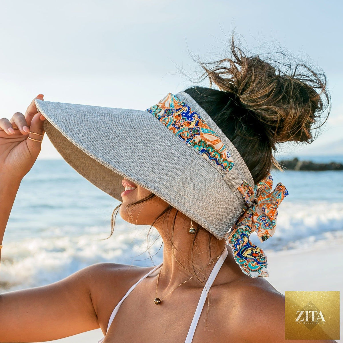 Aili's Corner sun visor with a stylish scarf accent, featuring a wide brim and lightweight design for sun protection and fashion.