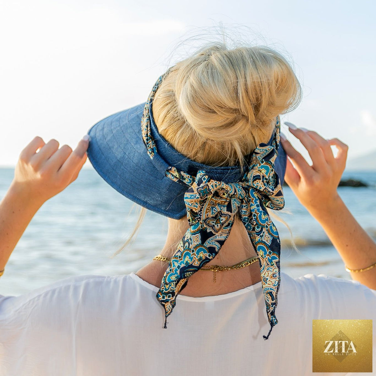 Aili's Corner sun visor with a stylish scarf accent, lightweight accessory for sun protection and fashion.
