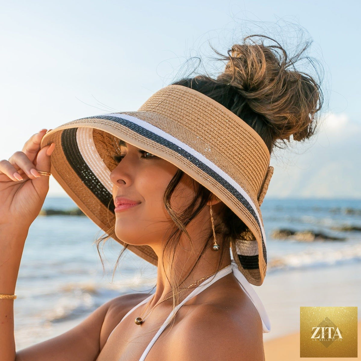 Color block roll-up sun visor by Aili's Corner, showing vibrant fabric with adjustable design and wide brim for sun protection.