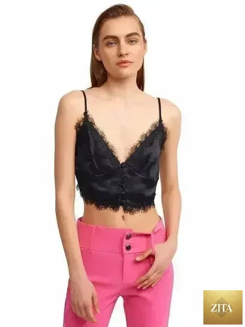 Lace detail crop top in rayon-viscose blend with feminine style, shown on a hanger. Femstylo crop top with delicate lace accents.