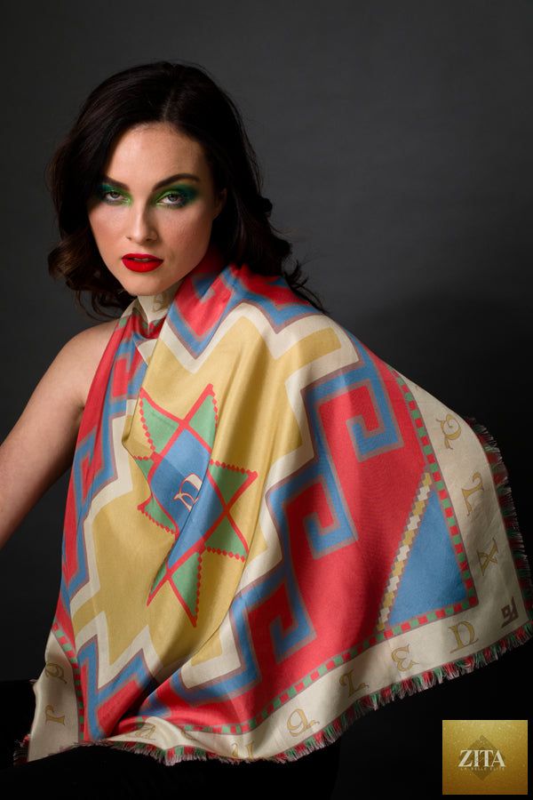 Silk square scarf featuring Armenian alphabet design in vibrant colors from Anet's Collection LLC, styled with geometric patterns.