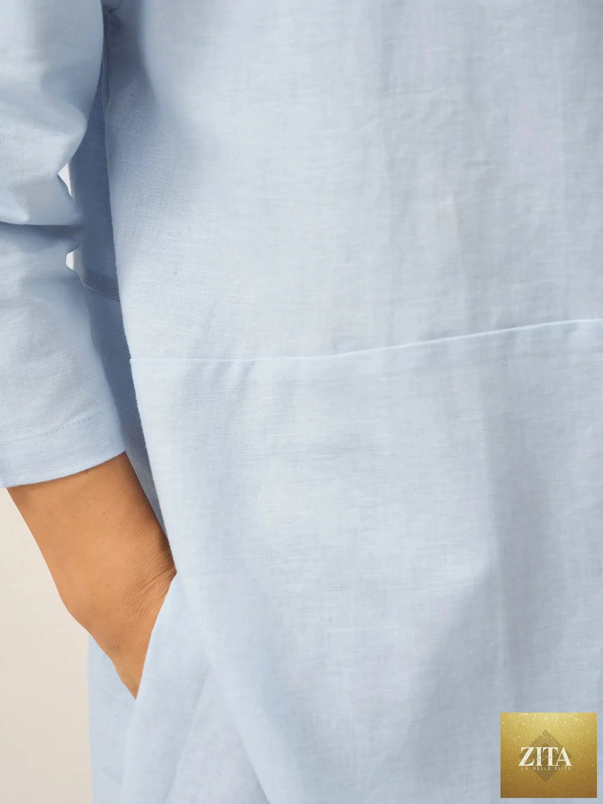 White linen blend boat neck oversized top by LINTICO, shown in sky blue, casual blouse with relaxed fit and flowing fabric.