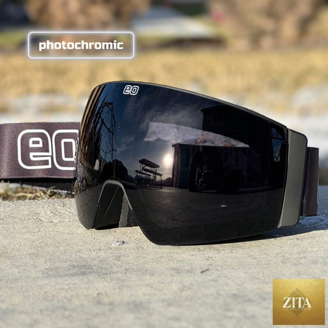 Eastern Outer Mach Schnell Mag photochromic ski and snowboard goggles in black with dark lenses, angled view.