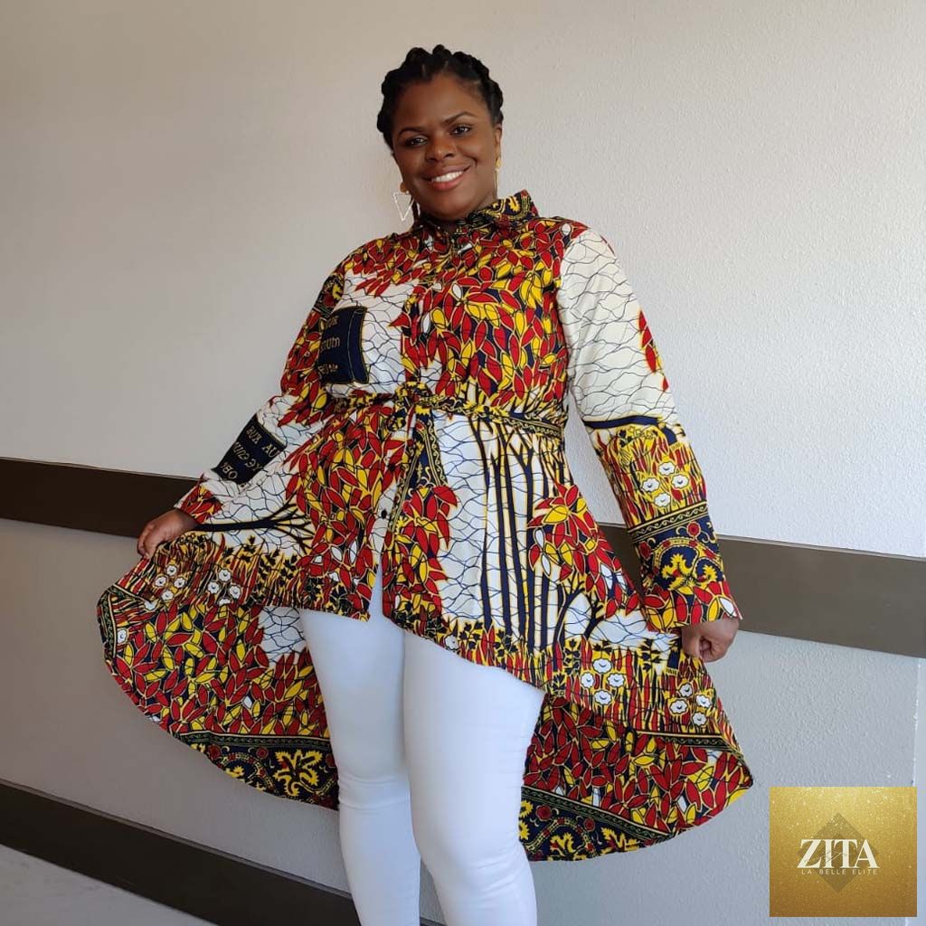 Duma Mbili LLC Kente African print high-low button-up blouse in white and red honey, featuring vibrant traditional patterns.
