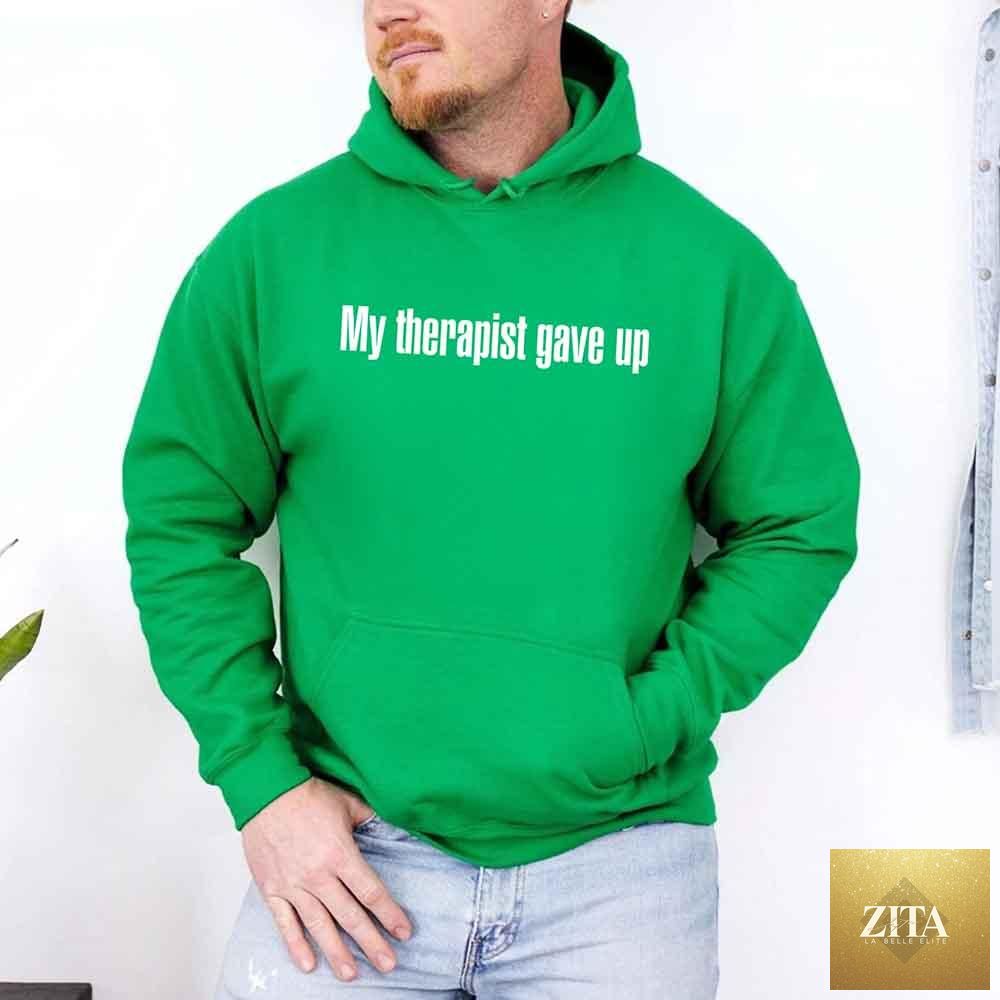 Comfortable black hoodie with humorous "My Therapist Gave Up" slogan, featuring bold white text, by Adorb Custom Tees.
