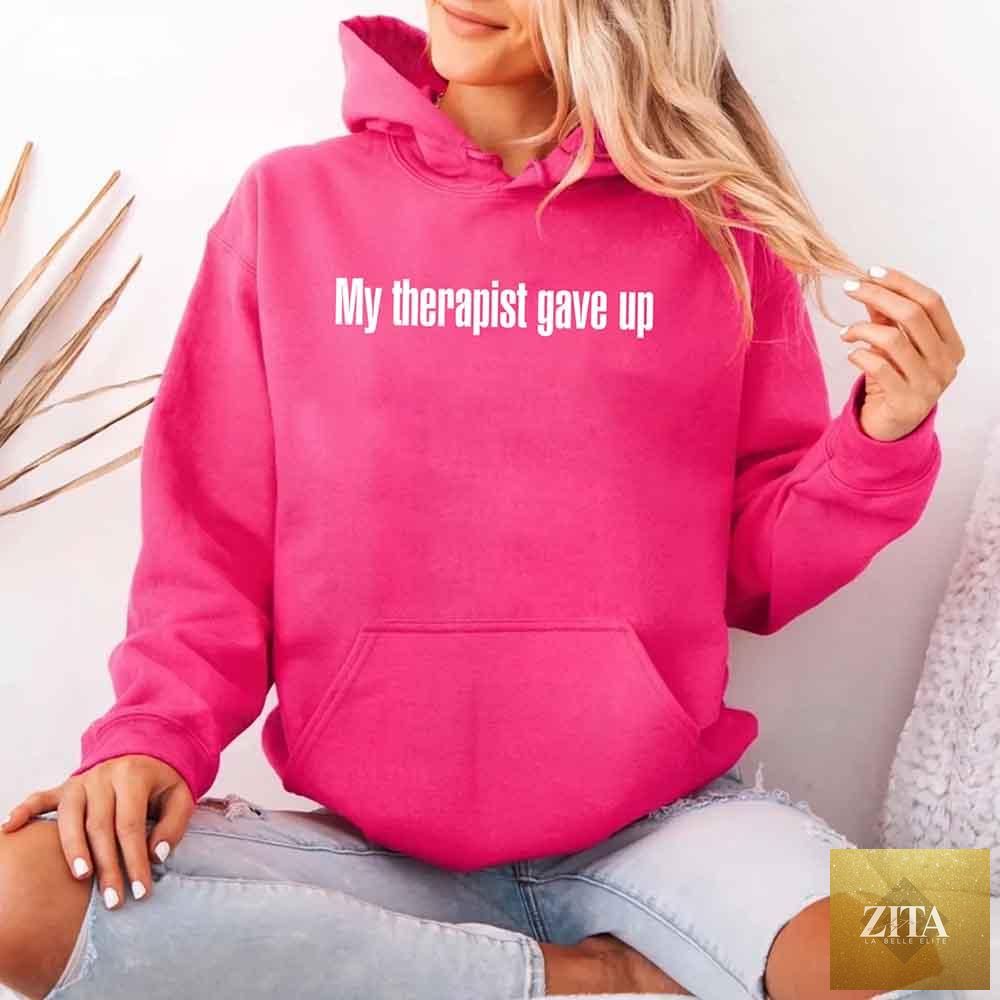 Gray hoodie with humorous text "My Therapist Gave Up" from Adorb Custom Tees, featuring a casual fit and printed design.