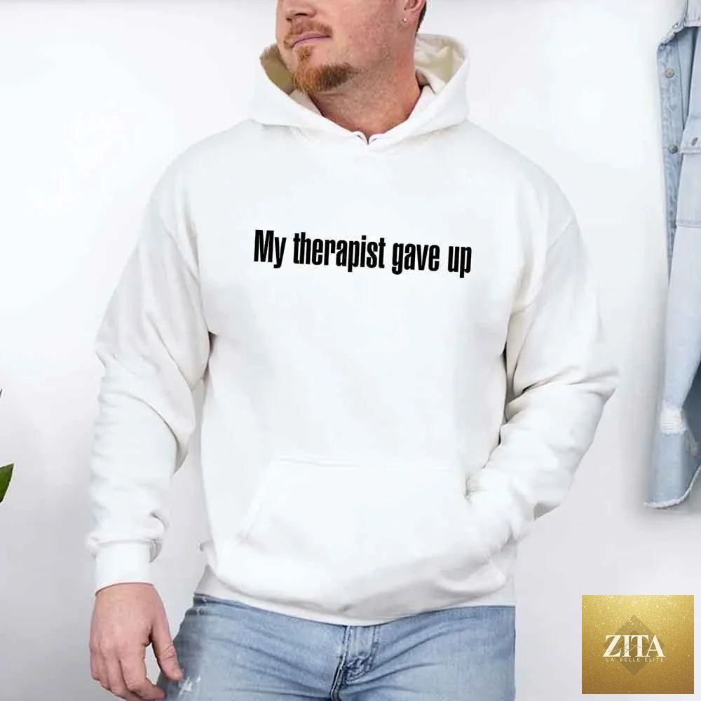Black hoodie from Adorb Custom Tees with humorous text "My Therapist Gave Up," featuring a casual fit and soft fabric.