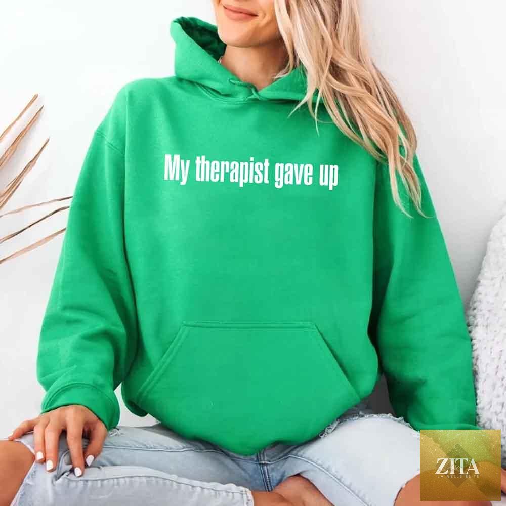 Black hoodie with white text reading "My Therapist Gave Up" from Adorb Custom Tees, showcasing a humorous, sarcastic design.