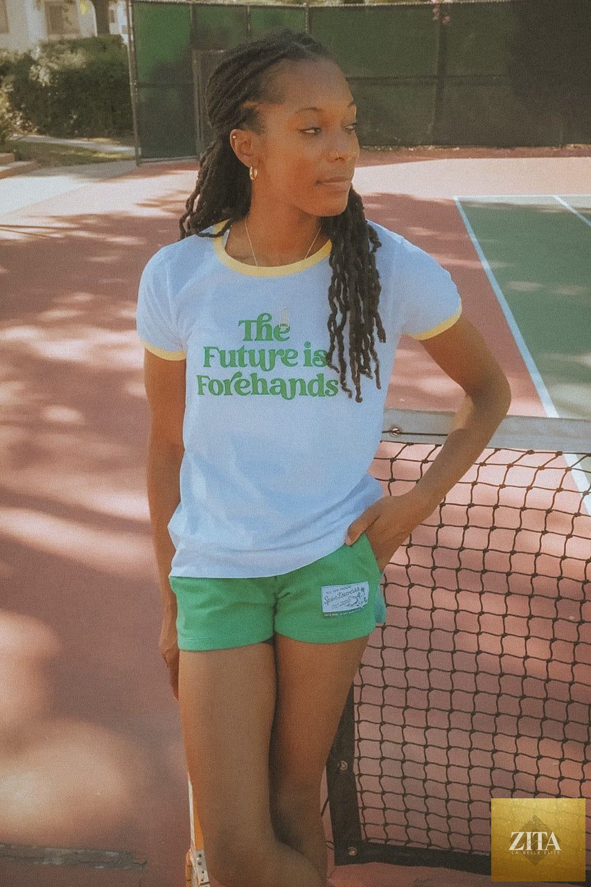 Ace The Moon The Future is Forehands Ringer Tee, a short sleeve t-shirt with a stylish design, shown on a hanger.
