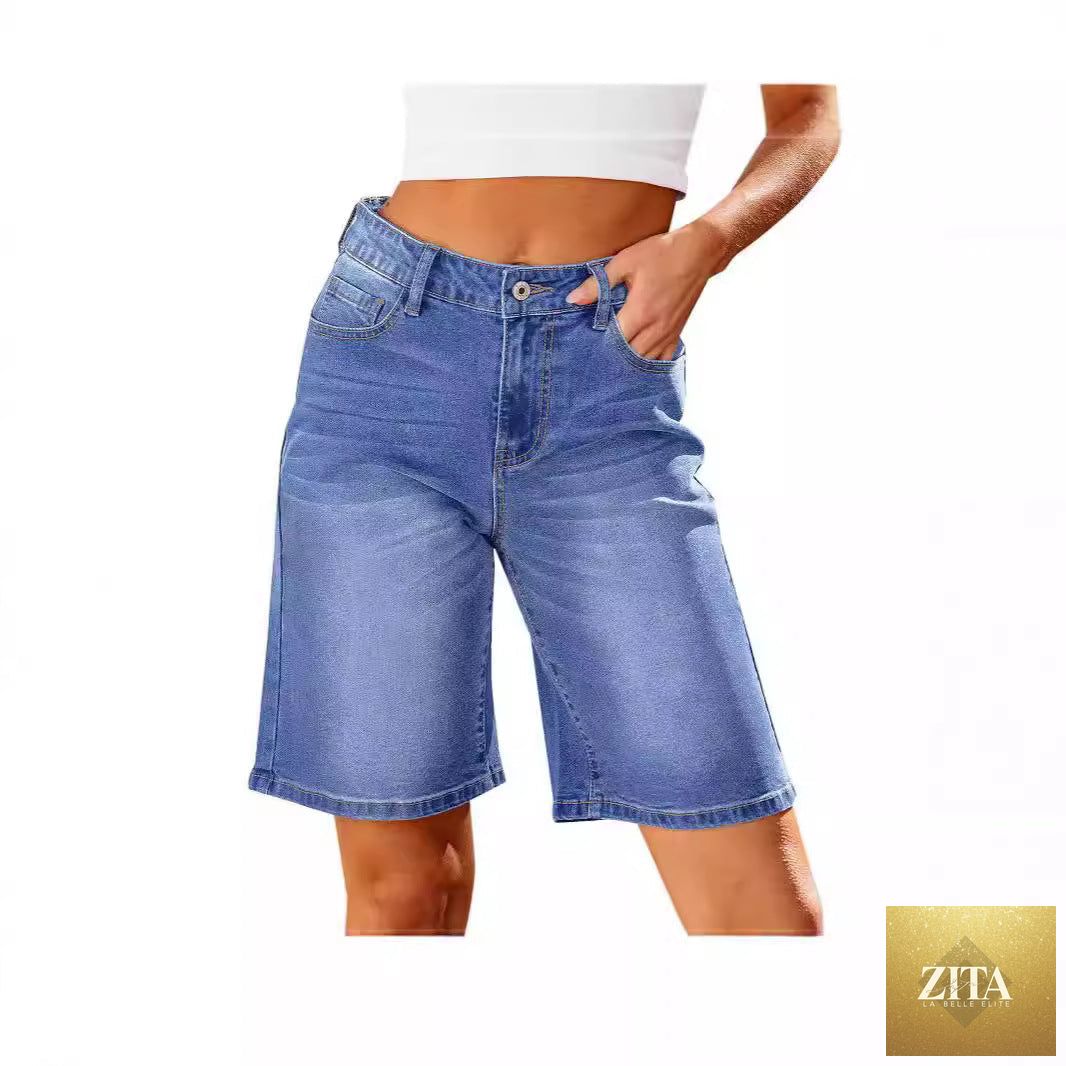 Women slim denim middle shorts from Wanita Store, showing the fitted mid-length design in classic blue denim fabric.