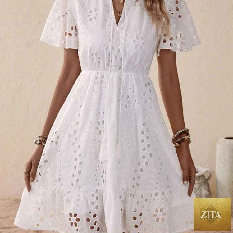 White embroidered lace V-neck dress with bubble sleeves from SHOMICOBOUTIQUE, detailed lace embroidery and elegant silhouette.