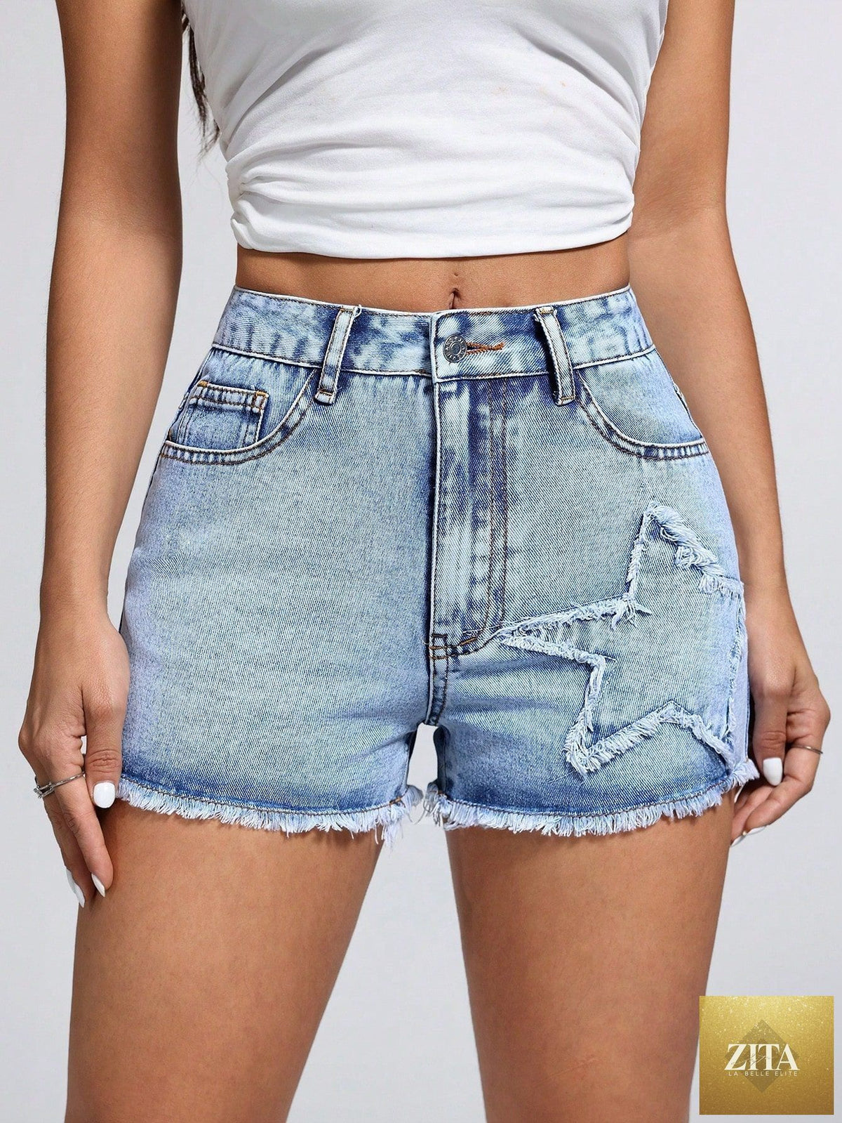 Women’s casual fashionable frayed hem denim shorts by Wanita Store, shown with distressed edges and classic denim wash.