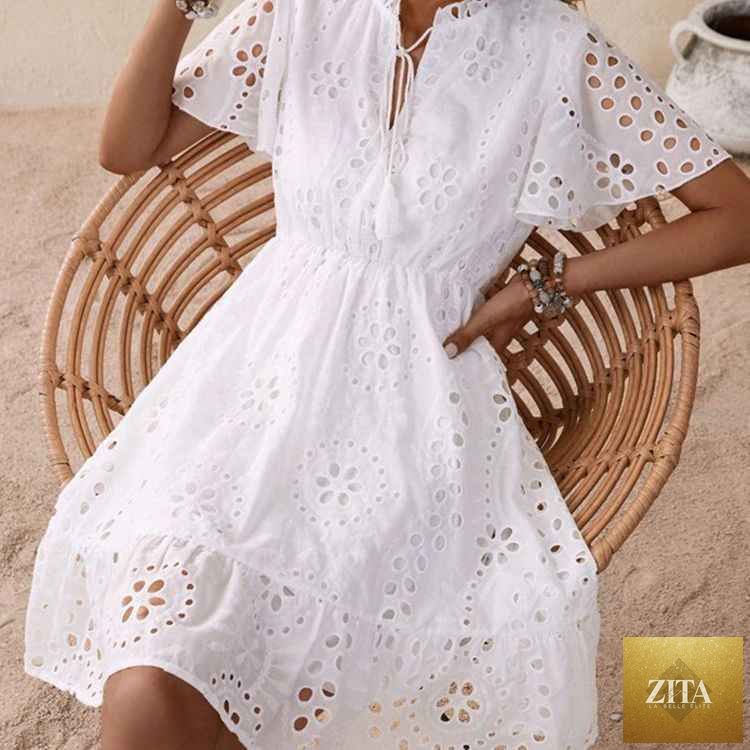 White embroidered lace V-neck dress with bubble sleeves from SHOMICOBOUTIQUE, featuring intricate lace details and a flattering silhouette.