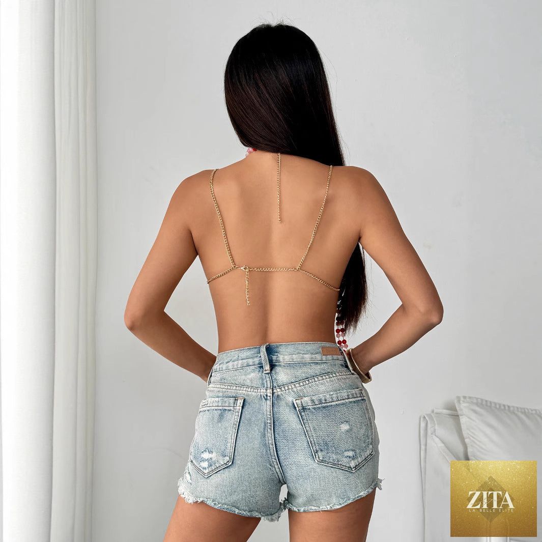 Backless halter camisole with multi-layer pearls and cutout details, stylish sexy bra by Wanita Store, shown on a model.