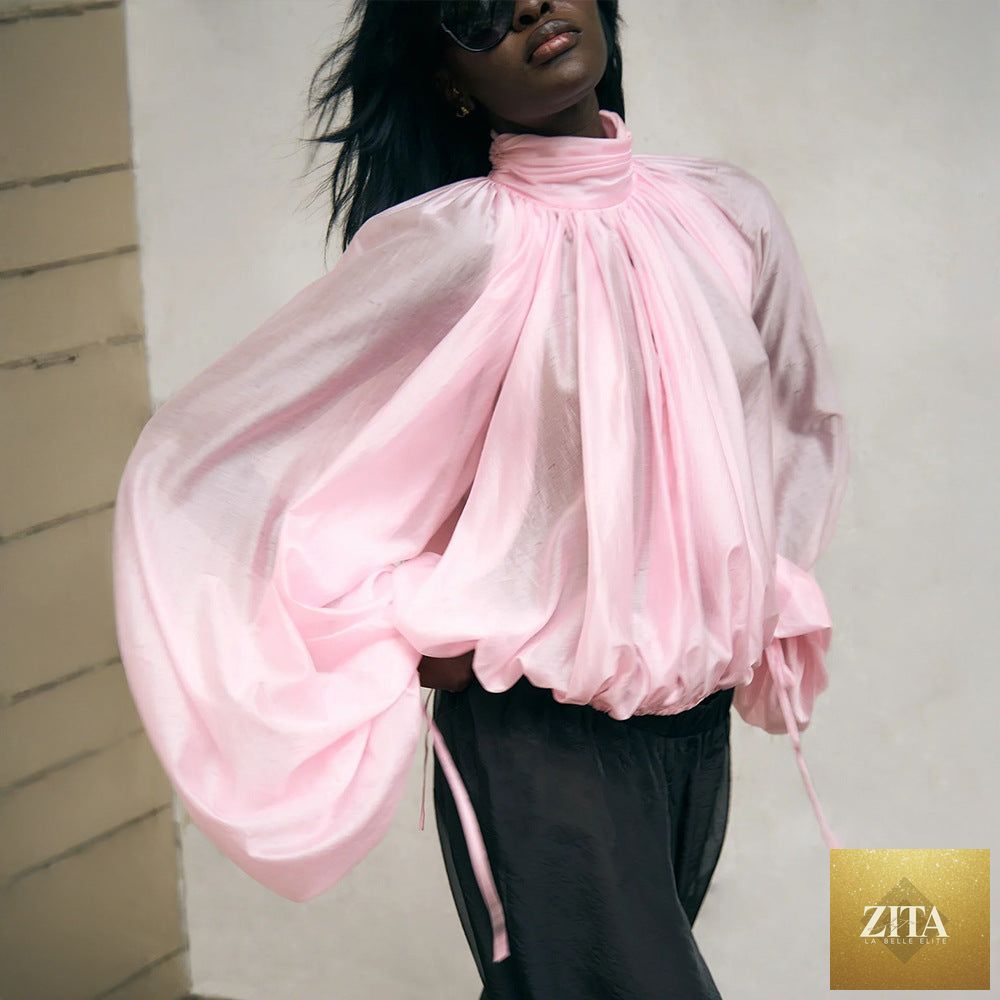 Semi-transparent lantern sleeve turtleneck long sleeve shirt with pleated design, ideal for spring and summer wear.