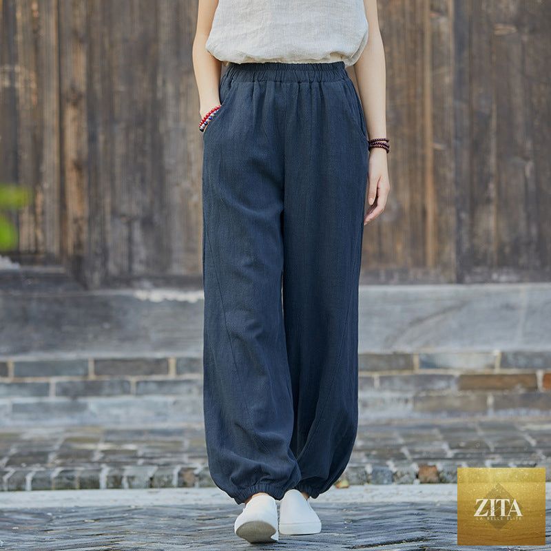 Light blue cotton linen women’s casual trousers with stone wash finish, featuring bamboo section and relaxed fit for spring and summer.