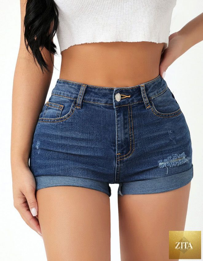 High waist elastic slim fit ripped jeans shorts for women, showcasing distressed denim and trendy design.