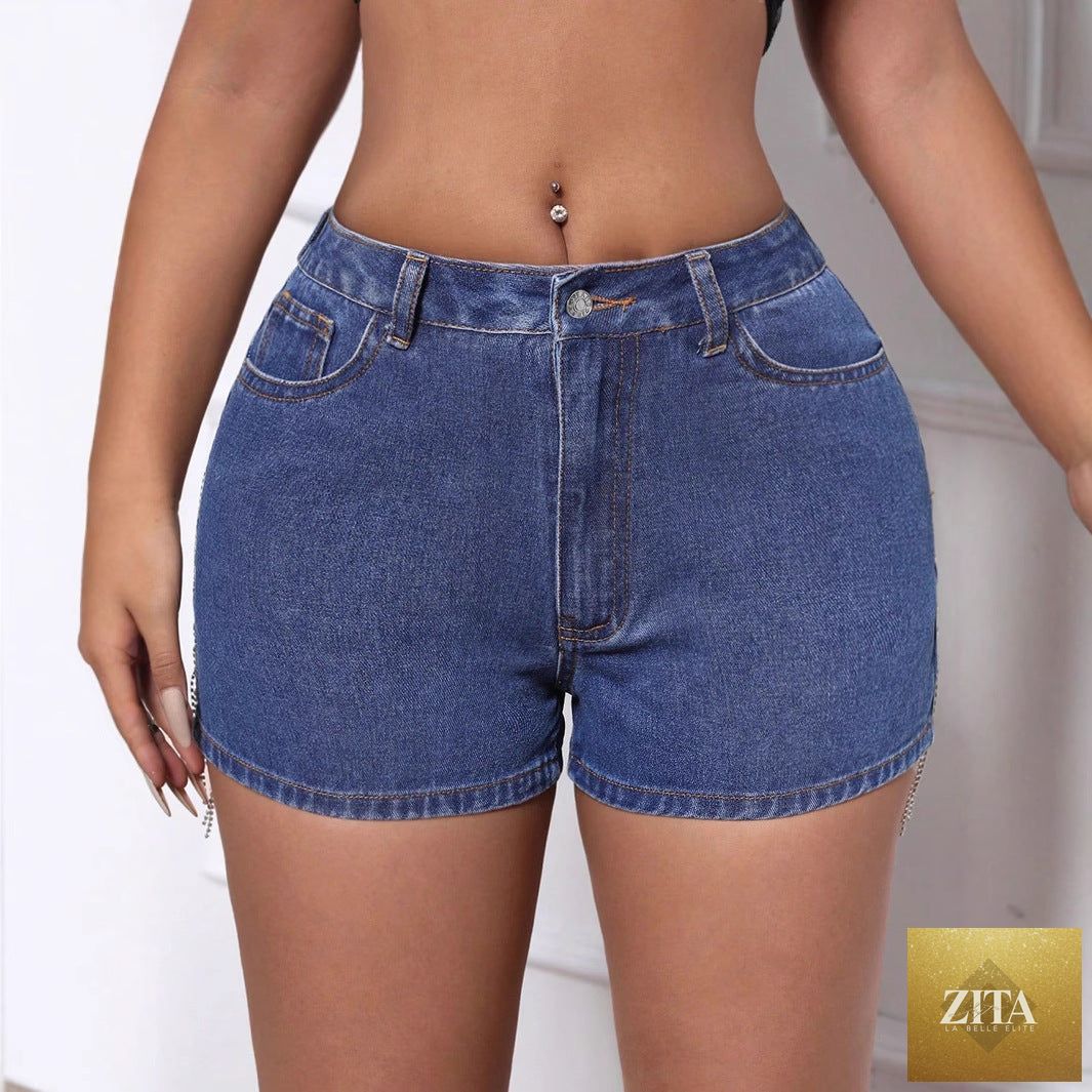 Women’s casual ripped denim shorts with chain and tassel details, stylish shorts from Wanita Store.