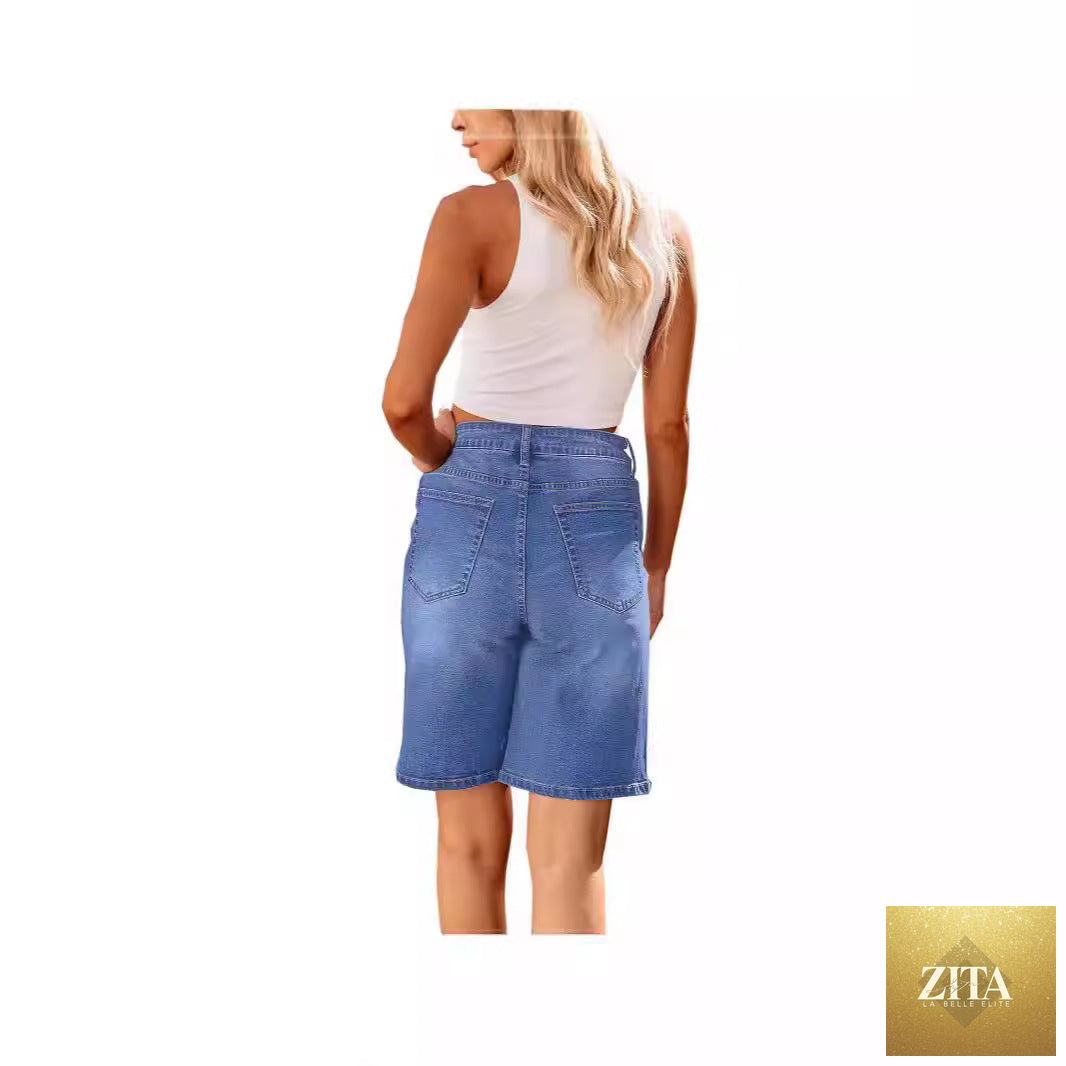 Women slim denim middle shorts from Wanita Store, showing a close-up of the fitted, mid-rise denim shorts with a clean finish.