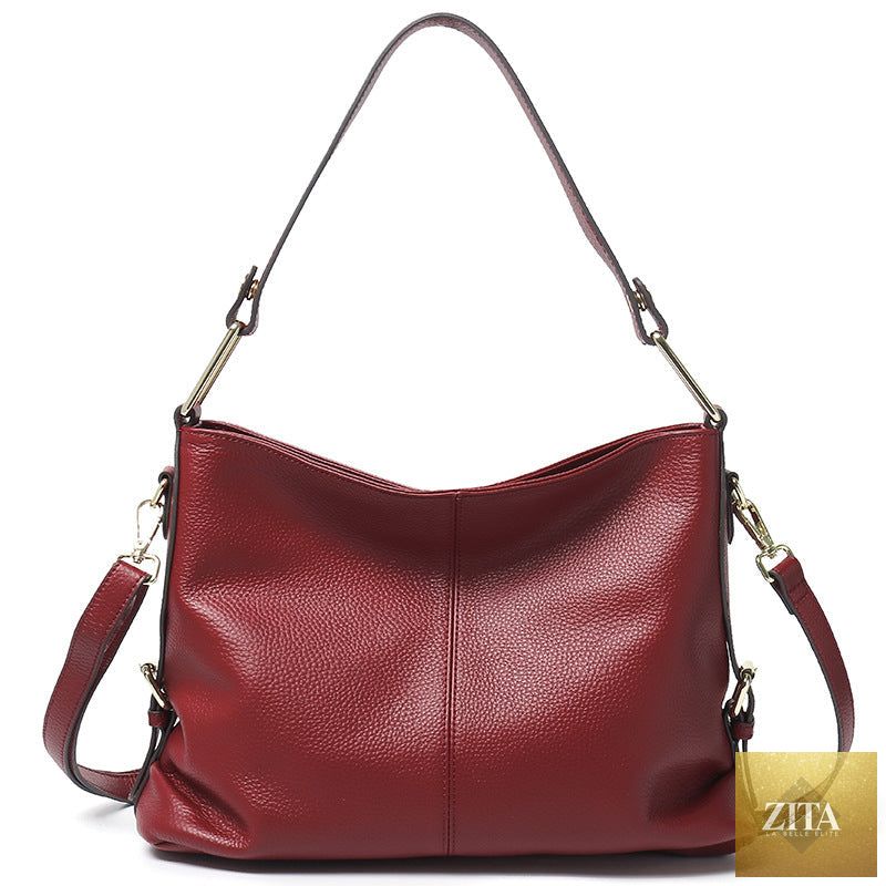 Elegant genuine leather handbag by SHOMICOBOUTIQUE featuring a stylish hobo and crossbody tote design, showcasing its sophisticated craftsmanship.