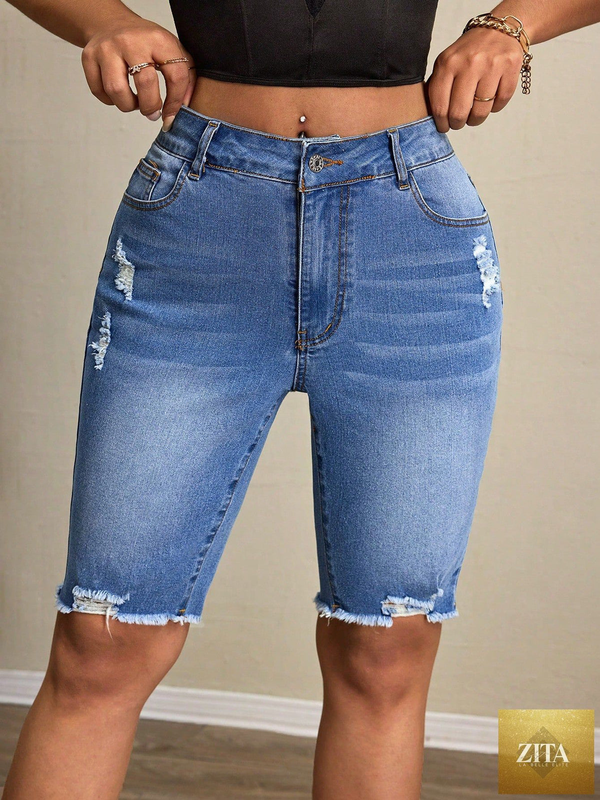 Women’s casual denim tight shorts by Wanita Store, featuring a fitted design and classic blue wash, suitable for everyday wear.