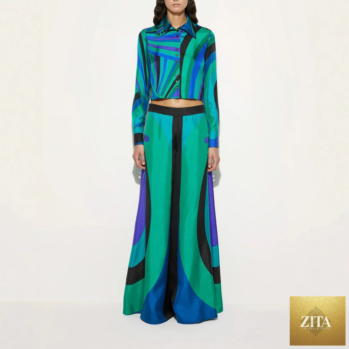 Satin long sleeve shirt and wide-leg trousers from Wanita Store in a stylish two-piece set, perfect for chic and comfortable fashion.