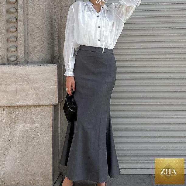 Long high waist brown autumn skirt for women, featuring a flowy design and classic style, perfect for office or casual wear.