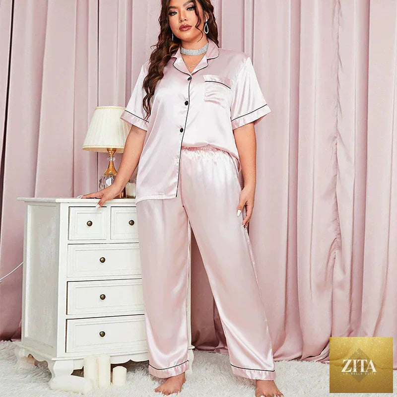 Plus size women’s silk pajama set by SMinvite, LLC with long sleeve top and matching pants, soft and luxurious fabric.