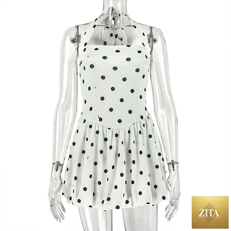 Black and white polka dot women’s sleeveless A-line dress with halter neckline, pleated design, from Ragazza.