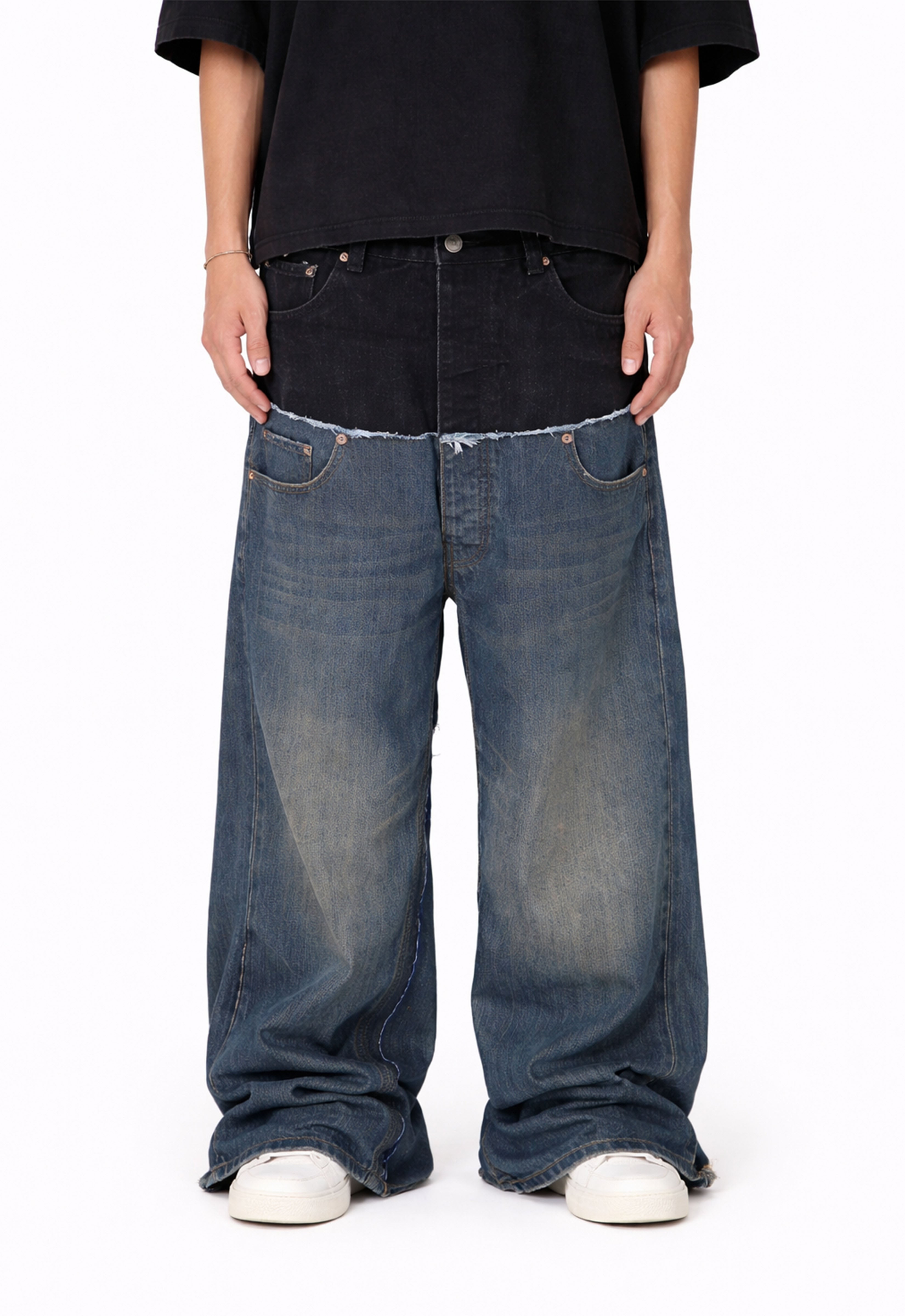 Model wearing UNDEVELOPED WIDEBOY MIDNIGHT double denim jeans, showcasing the relaxed fit and dark wash denim style.