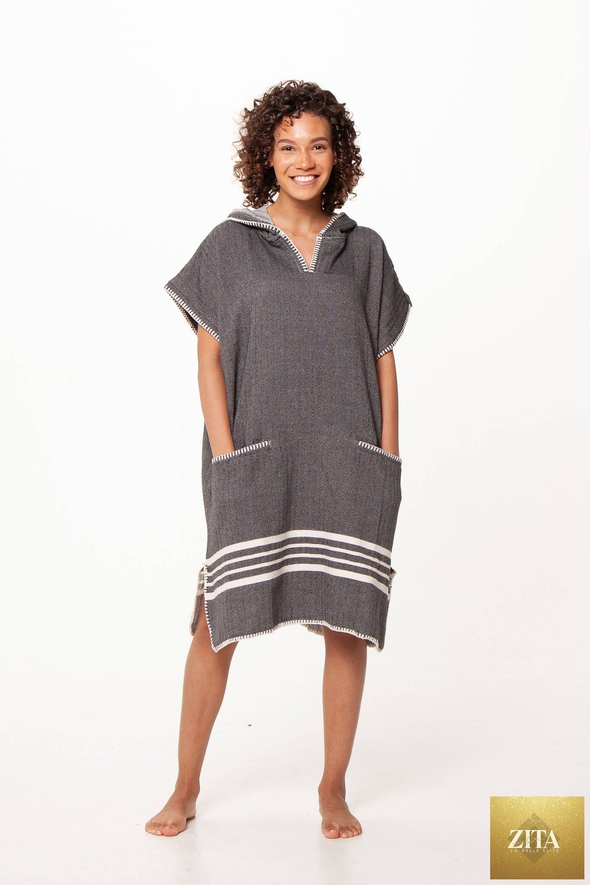 Black Zita La Belle Elite beach cover-up poncho with hood, featuring a relaxed fit and stylish design for beach or poolside wear.