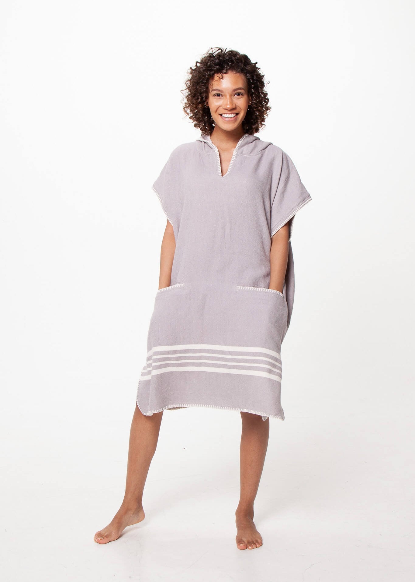 Grey Buldano beach cover-up poncho with hood, lightweight and comfortable for seaside or poolside wear.