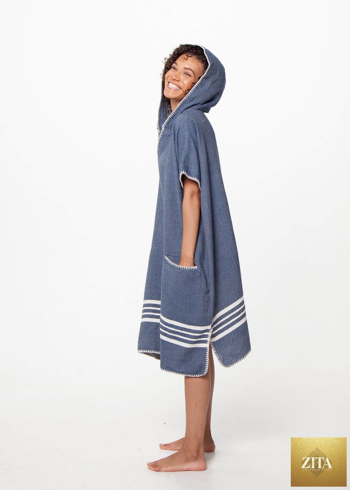 Navy blue Buldano beach cover up poncho with hood, lightweight and comfortable for seaside wear.