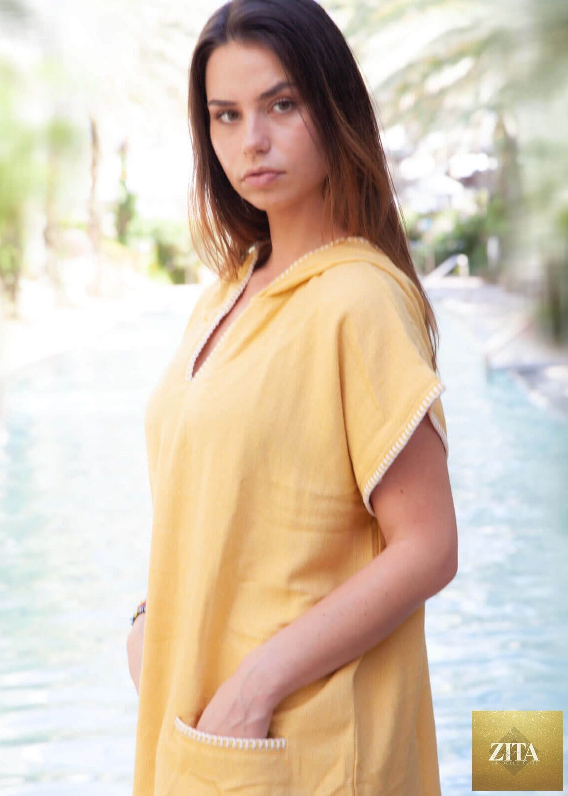 Yellow Zita La Belle Elite beach cover-up poncho with hood, lightweight and comfortable for seaside wear.
