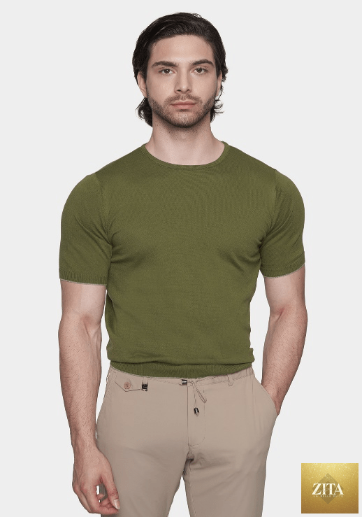 Bright Moons The Essential Shirt in moss green, featuring a classic fit and soft fabric, displayed on a hanger against a neutral background.