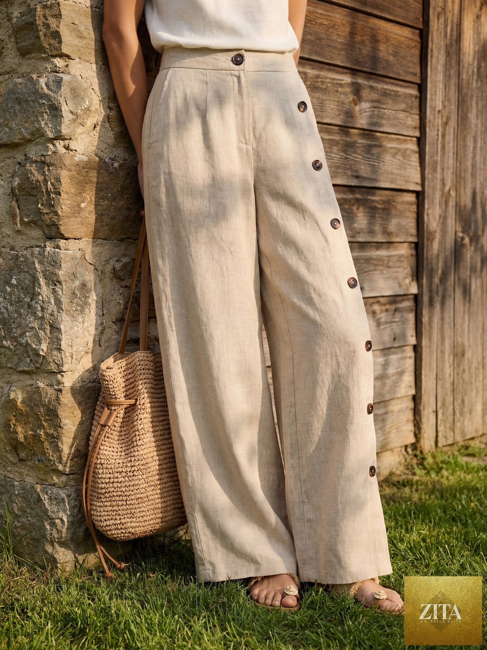 LINTICO 100% linen buttoned slit-hem pants in stone oat color, shown on a model, featuring a relaxed fit and stylish design.