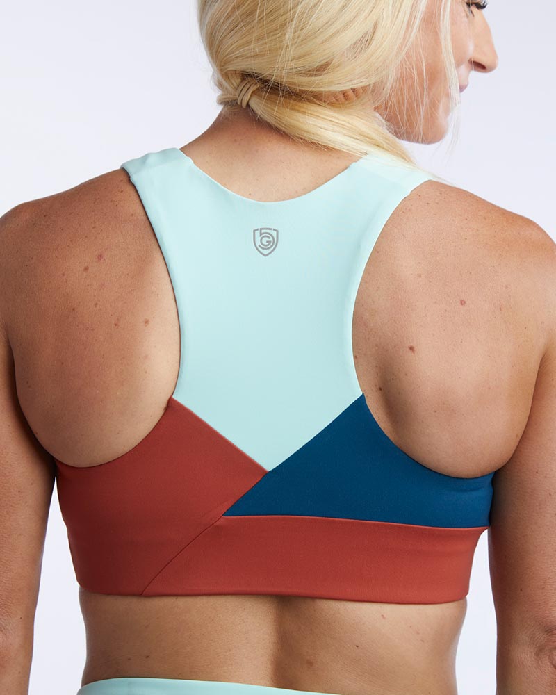 Goal Five Pionxr training bra top in dark teal, with a supportive fit and stylish design, shown from the back.