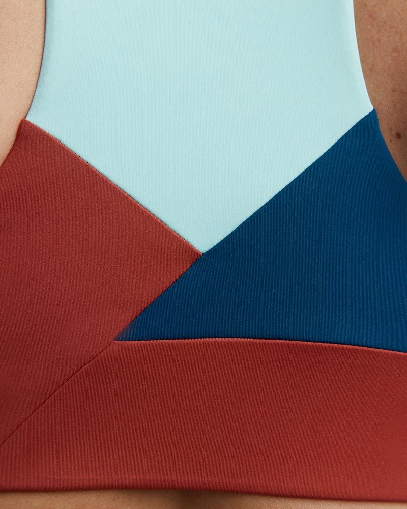 Goal Five Pionxr training bra top in dark teal, featuring a sleek, fitted design with supportive straps and vibrant color accents.