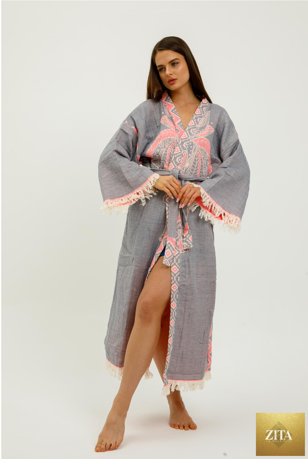 Pink jungle-themed kimono by Zita La Belle Elite with elephant print, flowing fabric, and intricate pattern details.