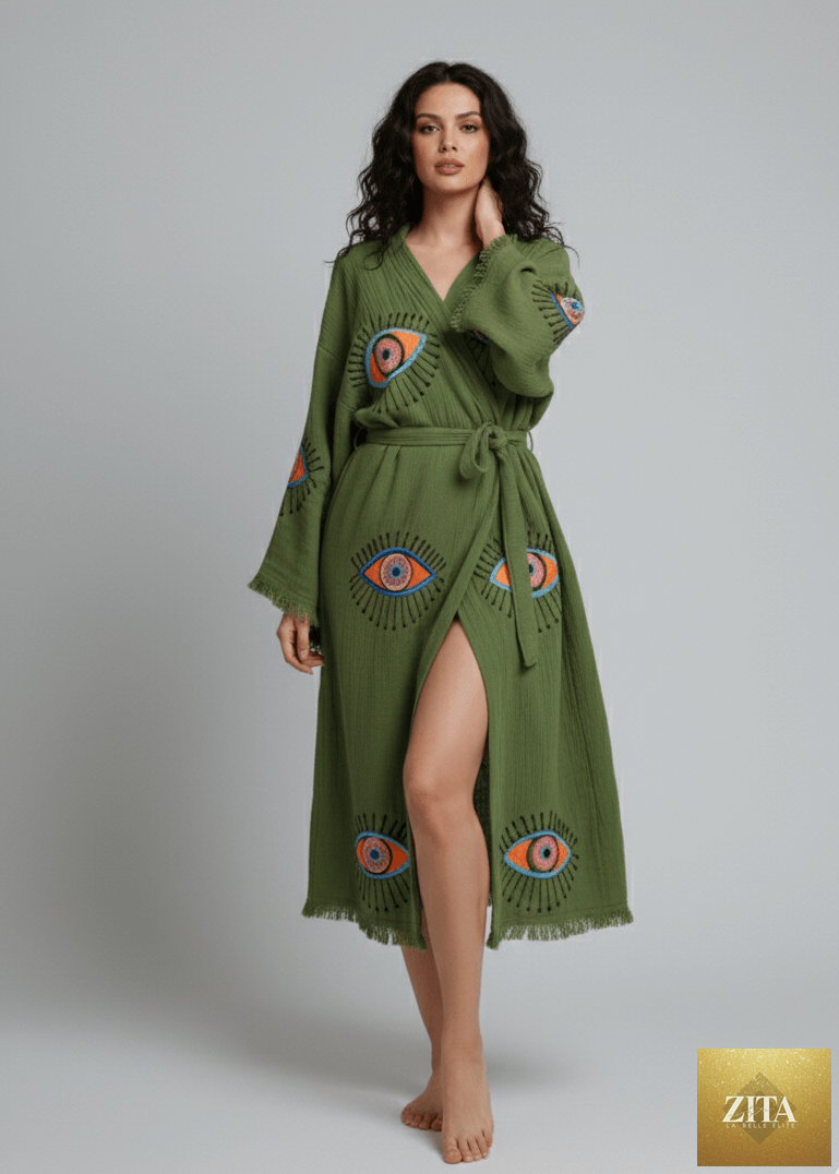 Green evil eye hand-printed kimono by Zita La Belle Elite, featuring natural fabric and intricate pattern details.