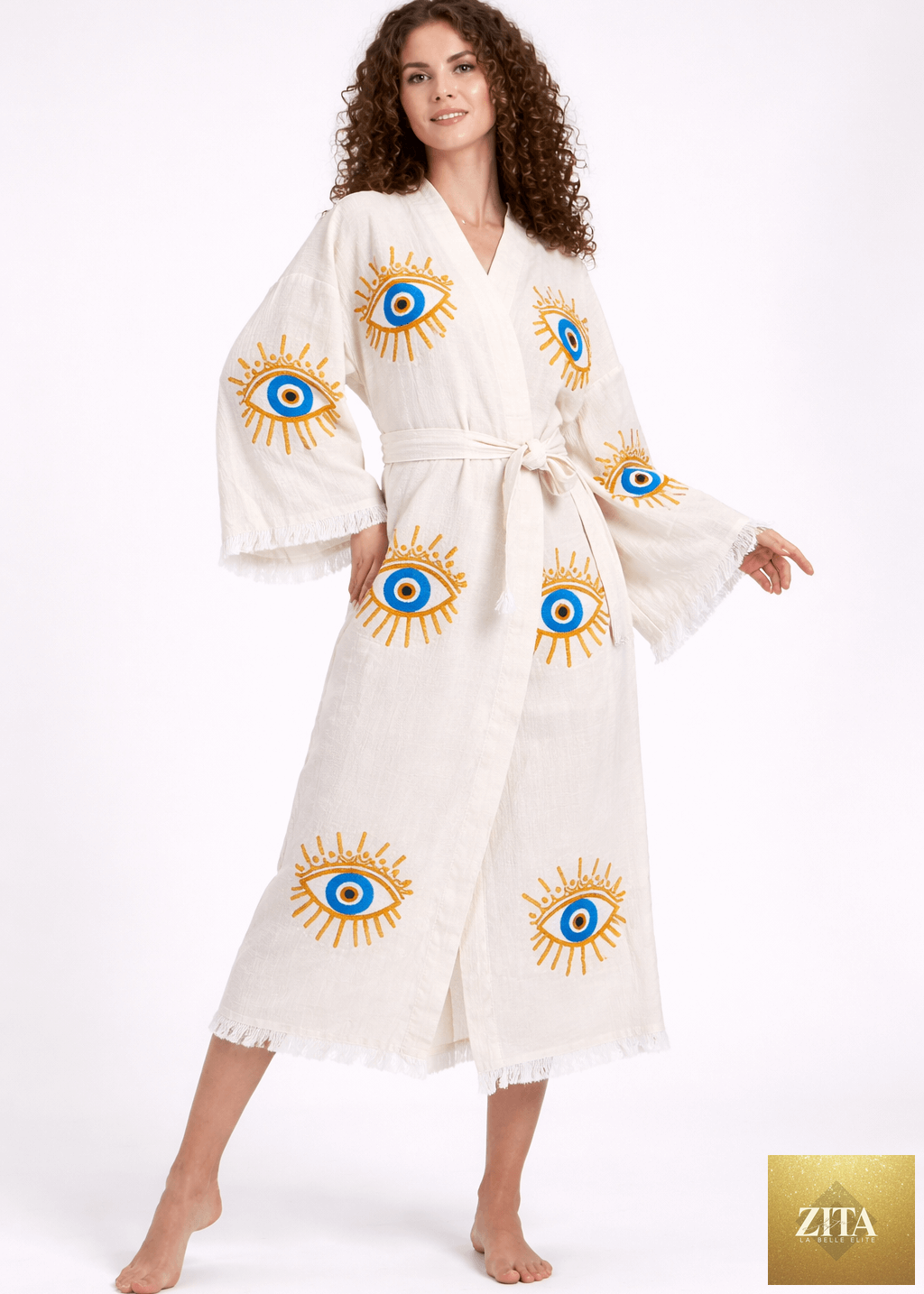 Hand-printed evil eye kimono in natural fabric by Buldano, showcasing intricate design and relaxed fit.