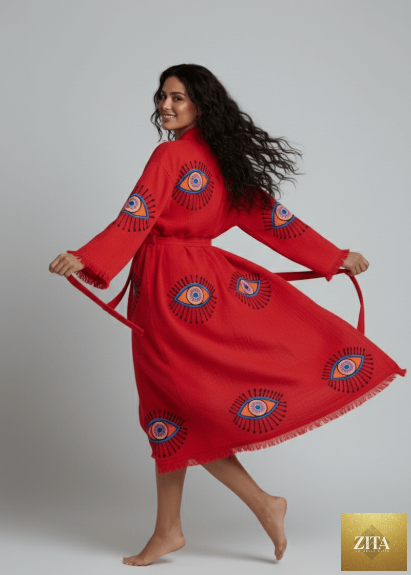 Red evil eye hand-printed kimono by Zita La Belle Elite, featuring natural fabric and intricate design details.
