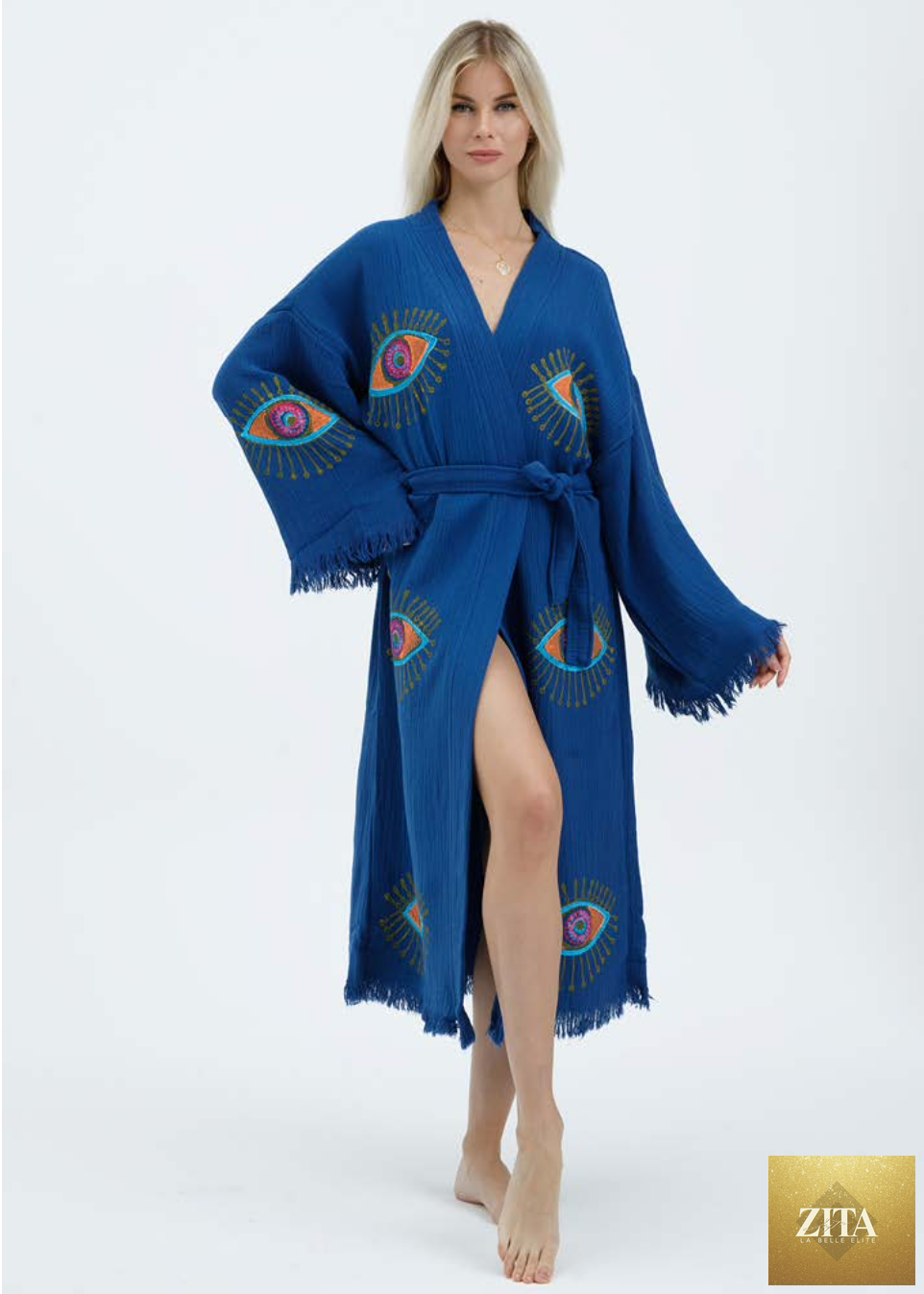 Hand-printed blue evil eye kimono by Zita La Belle Elite, featuring natural fabric and intricate design details.