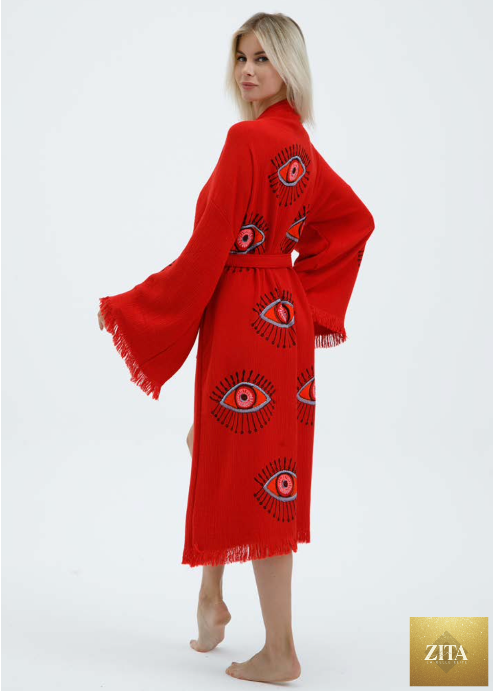 Hand-printed red evil eye design kimono by Zita La Belle Elite, featuring natural fabric and intricate patterns.