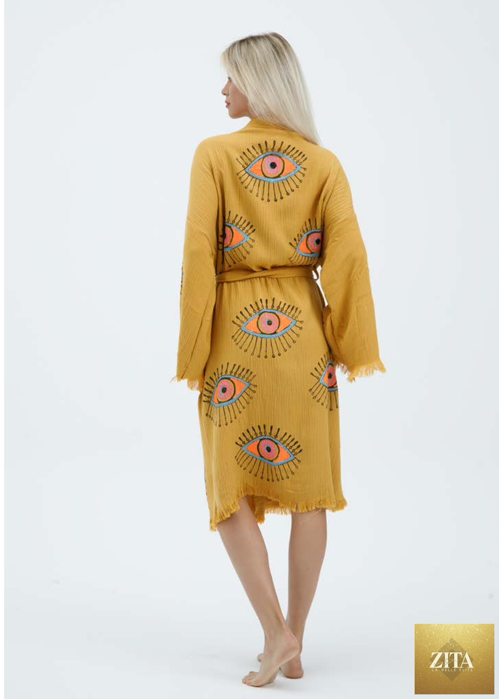 Yellow evil eye hand-printed kimono by Zita La Belle Elite, featuring natural fabric and intricate design details.