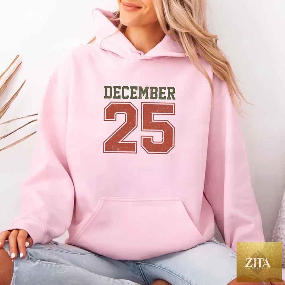 Red retro Christmas hoodie by Adorb Custom Tees featuring festive December 25 holiday design, cozy and stylish holiday wear.