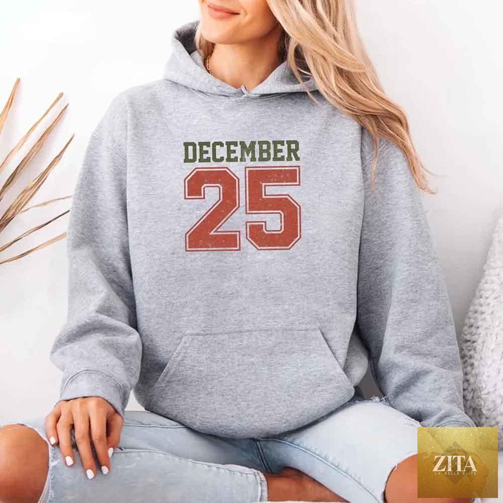 Retro Christmas hoodie by Adorb Custom Tees featuring festive holiday design for December 25, in a cozy, casual style.